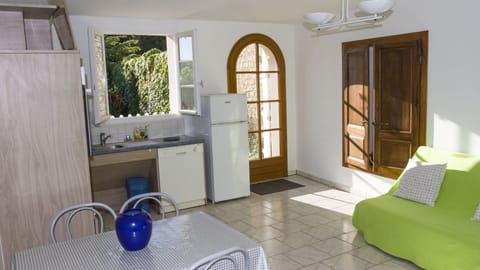 Family Apartment | Private kitchenette | Fridge, microwave, highchair