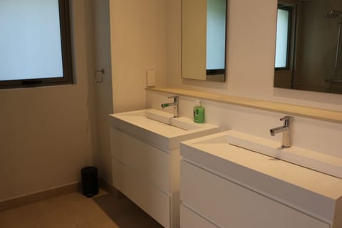 Family Suite, 4 Bedrooms | Bathroom | Rainfall showerhead, free toiletries, hair dryer, towels