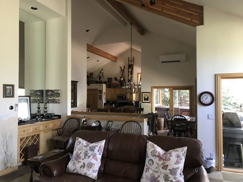 Open Floorplan with Wet Bar. Exposed Beams, TV, Access to Huge Deck and Hot Tub