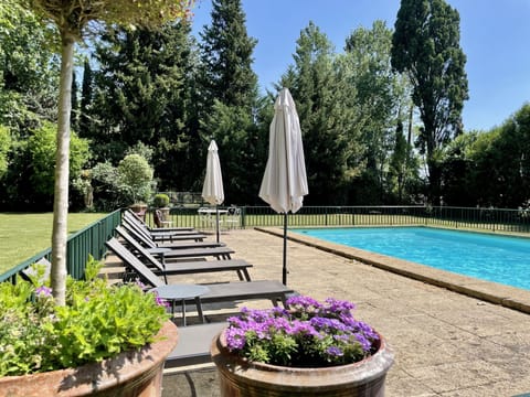 Seasonal outdoor pool, open 9:00 AM to 9:00 PM, pool umbrellas