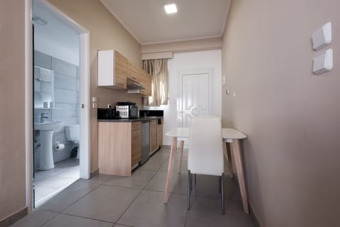 Deluxe Double Room, Pool Access | Private kitchen | Fridge, microwave, stovetop, electric kettle