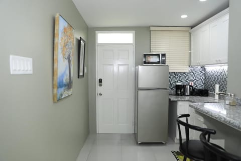 Apartment, Non Smoking | Private kitchen | Full-size fridge, microwave, oven, stovetop