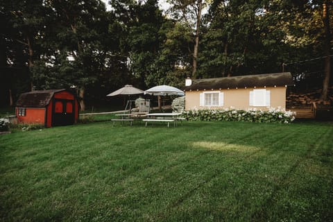View of Cottage from the Lake (Cottage has recently been painted Maroon)