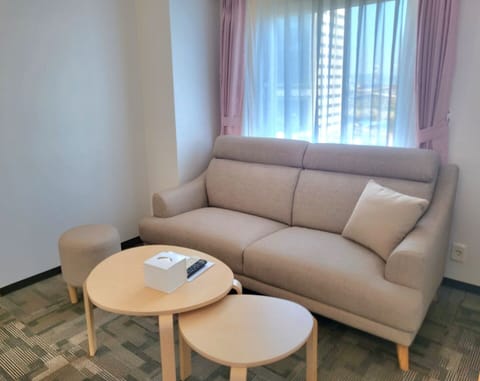 Family Twin Room, Non Smoking | Living area | Flat-screen TV