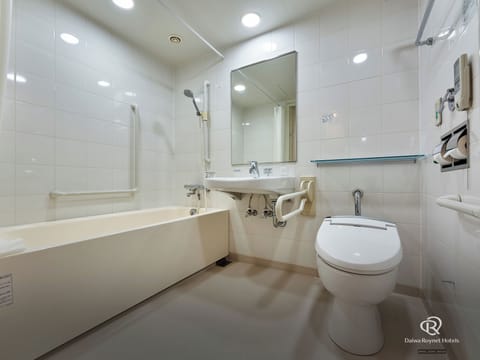 Combined shower/tub, free toiletries, hair dryer, slippers