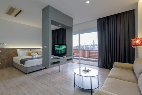 Junior Suite, Balcony, City View | Living area | 32-inch LCD TV with cable channels, TV