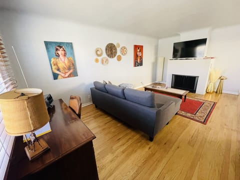Living room with a couch that fold outs to queen bed.