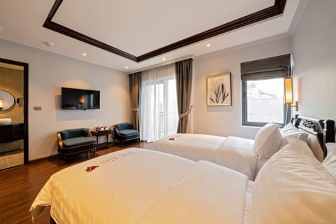 Deluxe Room with Balcony | Memory foam beds, minibar, in-room safe, desk