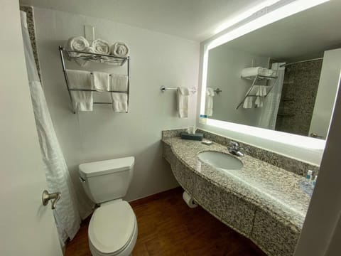 Standard Room, 2 Queen Beds, Non Smoking | Bathroom | Combined shower/tub, free toiletries, hair dryer, towels