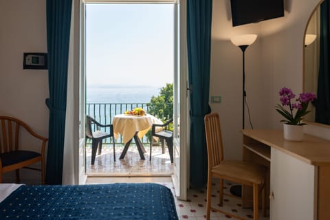 Superior Double Room, Balcony, Sea View | Minibar, in-room safe, desk, travel crib