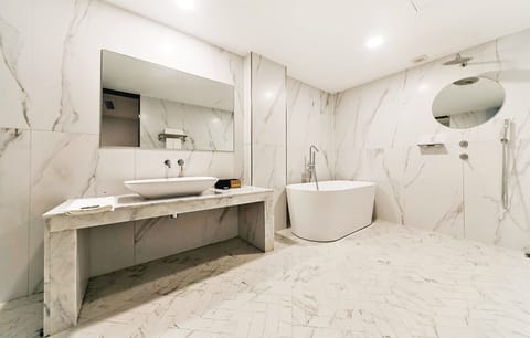 Premium A | Bathroom | Shower, designer toiletries, hair dryer, bathrobes