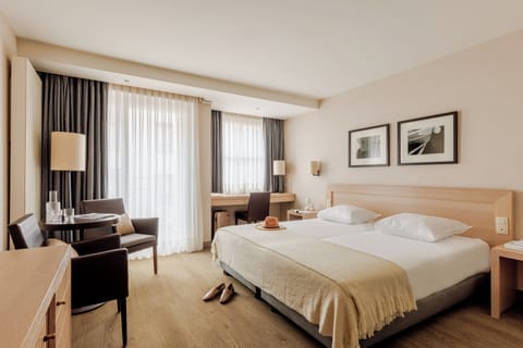 Down comforters, minibar, in-room safe, individually furnished