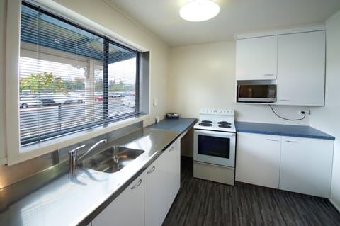 Economy Apartment, 2 Bedrooms | Private kitchen | Fridge, microwave, stovetop, electric kettle