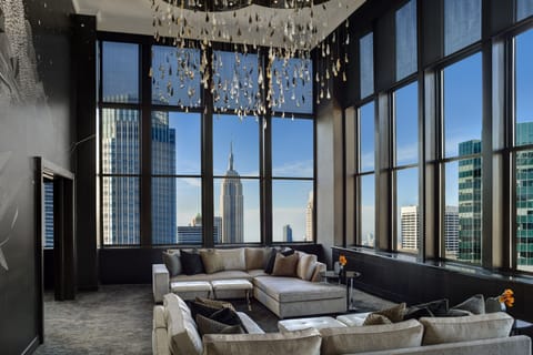 Penthouse Suite | Living area | 42-inch plasma TV with cable channels, TV, video-game console