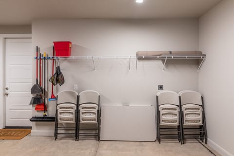 Garage - Located inside the garage you will find extra tables and chairs with pickleball paddles and balls.