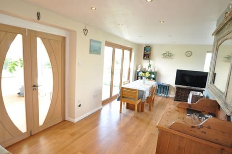 Trifold doors to Sun terrace and double doors to sun room.