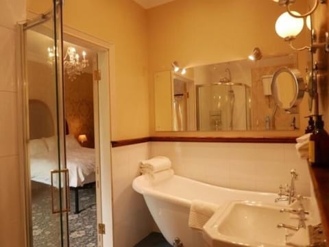 Separate tub and shower, deep soaking tub, hair dryer, bathrobes