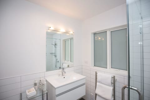 Birdsong Retreat | Bathroom | Shower, rainfall showerhead, designer toiletries, hair dryer