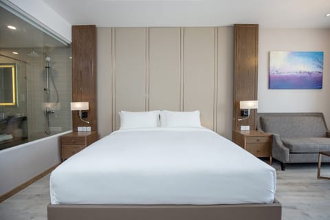 Premium Double Room, 1 King Bed, Partial Sea View | Premium bedding, desk, laptop workspace, blackout drapes