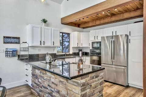 Renovated kitchen with modern appliances. Fully stocked with basic kitchen necessities.