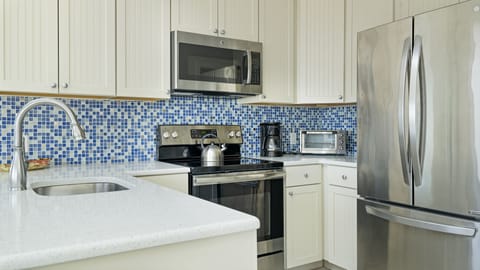 Ocean View 2BD Corner King and Queen | Private kitchen | Full-size fridge, microwave, stovetop, dishwasher