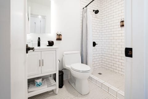 Suite, Multiple Beds | Bathroom | Shower, designer toiletries, hair dryer, towels