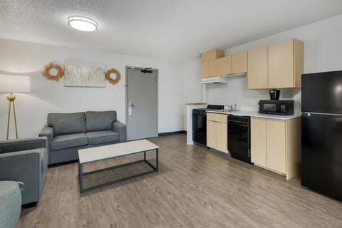 Suite, 1 King Bed, Balcony, Pool View | Iron/ironing board, bed sheets