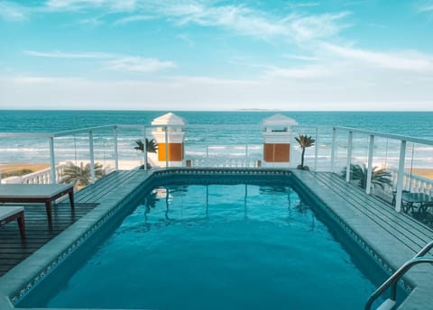 Outdoor pool, pool umbrellas, sun loungers