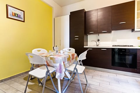 Apartment, 3 Bedrooms | Private kitchen | Full-size fridge, microwave, oven, stovetop