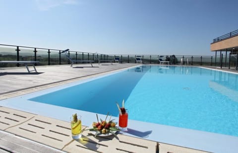 Outdoor pool, open 10 AM to 11 PM, sun loungers