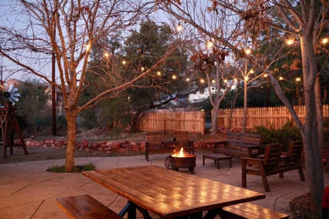 Globe string lights and fire pit provide a relaxing ambiance at night