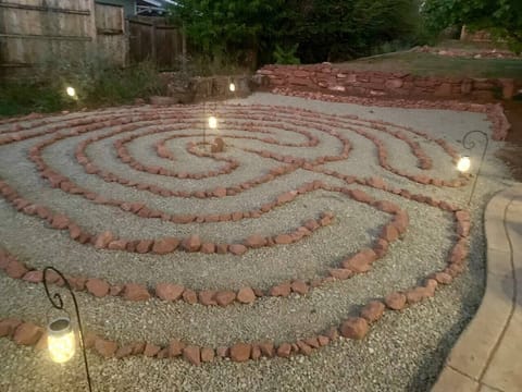 Walk the labyrinth and meditate as the firefly decor lights up the path
