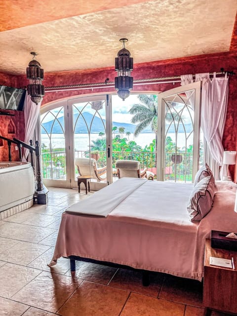 Luxury Room, Lagoon View, Poolside | In-room safe, iron/ironing board, bed sheets, alarm clocks