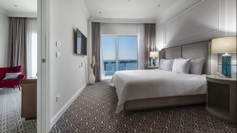 Luxury Suite, Balcony, Sea View | Hypo-allergenic bedding, minibar, in-room safe, desk