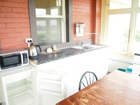 Family Room, 1 Bedroom | Private kitchenette | Mini-fridge, microwave, stovetop, coffee/tea maker