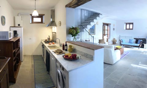 wider view of the kitchen/ living space