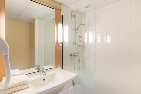 Shower, eco-friendly toiletries, hair dryer, towels