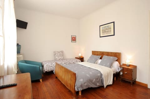 Triple Room | Iron/ironing board, free cribs/infant beds, rollaway beds, free WiFi