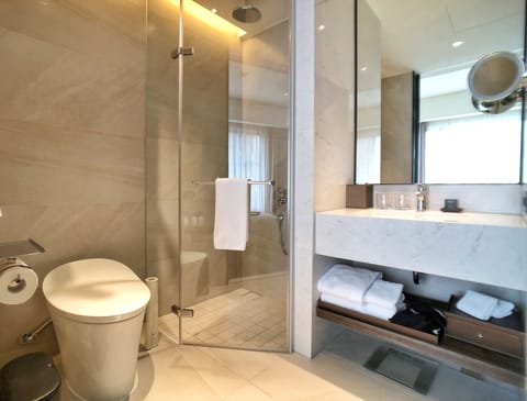 Urban Deluxe Room | Bathroom | Designer toiletries, hair dryer, bathrobes, slippers
