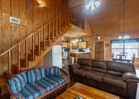 Living room view of kitchen and staircase