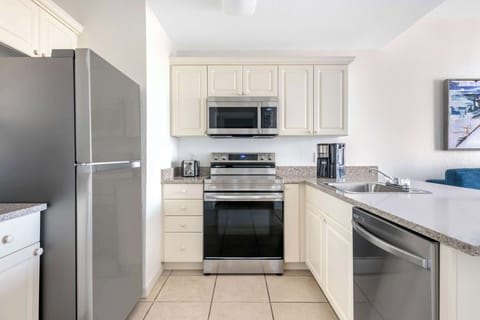 1 Bedroom 1 King Suite With Balcony | Private kitchen | Fridge, microwave, oven, stovetop