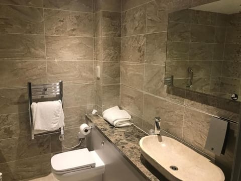 Suite, 1 King Bed, Non Smoking | Bathroom | Combined shower/tub, rainfall showerhead, free toiletries, hair dryer