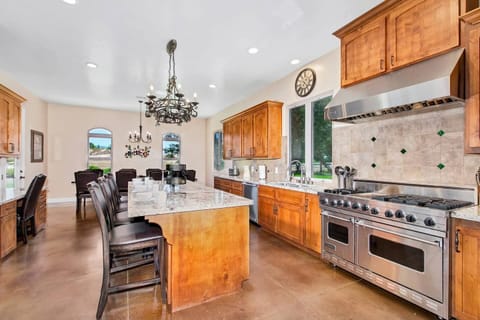 A 6-burner gas range and a large fridge make meal preparation simple