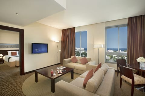 Suite, 2 Bedrooms (Seasons) | Living area | 39-inch LCD TV with satellite channels, TV, DVD player