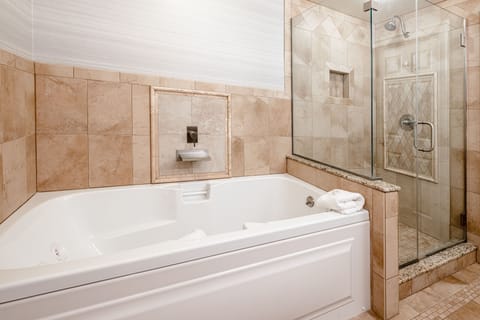 The Oxford One Bedroom Suite | Bathroom | Jetted tub, free toiletries, hair dryer, bathrobes