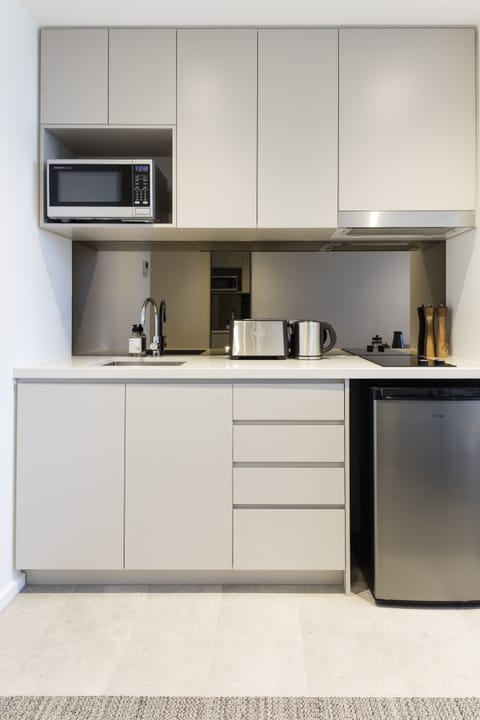 Studio | Private kitchenette | Full-size fridge, microwave, stovetop, dishwasher