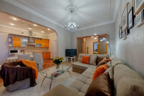 City Apartment, 3 Bedrooms | Living area | Flat-screen TV