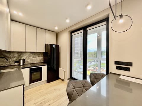 Comfort Apartment | Private kitchen | Full-size fridge, microwave, oven, stovetop