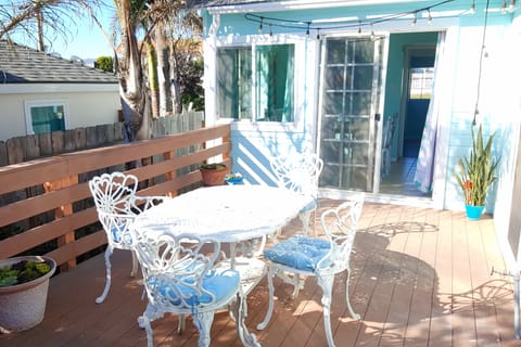 Three sets of sliding doors lead to the huge deck, with tons of seating.