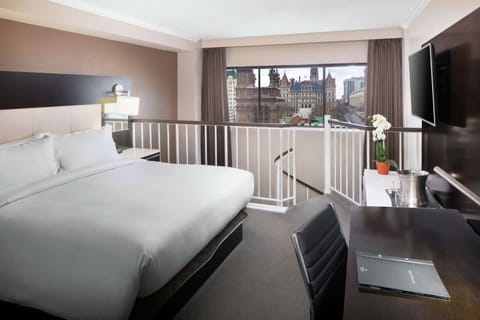 Suite | Premium bedding, down comforters, pillowtop beds, in-room safe